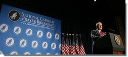 President George W. Bush smiles as he speaks at the National Catholic Prayer Breakfast Friday, April 18, 2008, at the Washington Hilton Hotel. Speaking about his visit this week with Pope Benedict XVI, the President said, "The Holy Father strongly believes that to whom much is given much is required -- and he is a messenger of God's call to love our neighbors as we'd like to be loved ourselves."  White House photo by Chris Greenberg