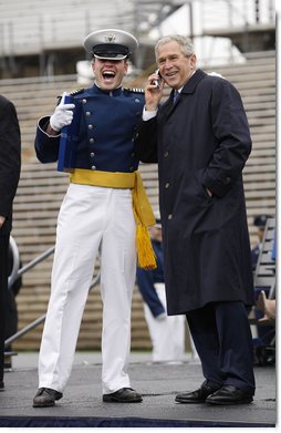 President George W. Bush shares a phone conversation with a graduate of the United States Air Force Academy Wednesday, May 28, 2008, after commencement ceremonies in Colorado Springs. The President told the class of 2008, "You're the 50th graduating class in the history of the Air Force Academy. Each of you has worked hard to reach this moment. I'll leave this campus today filled with the confidence in the course of our struggle and the fate of our country, because I've got confidence in each of you." White House photo by Eric Draper