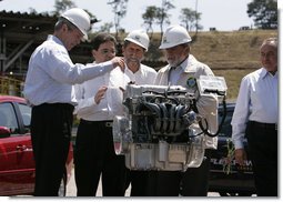 President George W. Bush and President Luiz Inacio Lula da Silva participate in a demonstration Friday, March 9, 2007, at the Petrobras Transporte S.A. Facility in Sao Paulo. With them is Sergio Gabrielle, chief executive officer of Petrobas. "One of the things I like, as the President (Luiz Inacio Lula da Silva) noted, is that a good ethanol policy and good alternative fuel policy actually leads to more jobs, not less," said President Bush during his remarks at the fuel facility. White House photo by Paul Morse