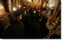 President George W. Bush is joined by Khouloud Daibes, Minister of Tourism, as they meet with clergy at the Church of Nativity Thursday, Jan. 10, 2008, in Bethlehem. White House photo by Eric Draper