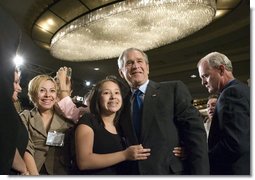 President George W. Bush greets audience members after addressing the National Hispanic Prayer Breakfast Friday, June 15, 2007, in Washington, D.C. “Our nation is more hopeful because of the Hispanic Americans who serve in the armies of compassion, who are surrounding neighbors in need who hurt with love; people who are helping to change America one heart and one soul and one conscience at a time,” said the President in his remarks. White House photo by Joyce N. Boghosian