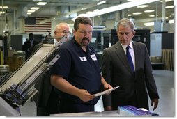 President George W. Bush talks with employees during his visit to ColorCraft of Virginia, Inc. Wednesday, March 26, 2008, in Sterling, Virginia. White House photo by Chris Greenberg