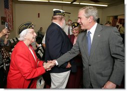 President George W. Bush greets members of the audience after attending a Fallen Soldiers National Memorial Ceremony at the American Legion Post 121 in Waco, Texas Sunday, Nov. 11, 2007. White House photo by Eric Draper