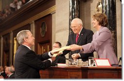 President George W. Bush delivers copies of his speech to Speaker of the House Nancy Pelosi (D-California) and Vice President Dick Cheney before delivering his 2008 State of the Union address Monday, Jan. 28, 2008, at the U.S. Capitol. White House photo by Eric Draper