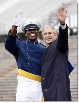 President George W. Bush celebrates with an unidentified graduate Wednesday, May 28, 2008, during commencement exercises at the United States Air Force Academy in Colorado Springs. White House photo by Eric Draper