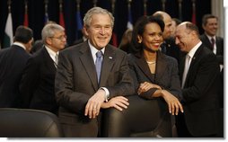 President George W. Bush stands with Secretary of State Condoleezza Rice Thursday, April 3, 2008, during the North Atlantic Council Summit in Bucharest. White House photo by Eric Draper