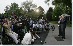 President George W. Bush and President Alvaro Uribe of Colombia, deliver statements Wednesday, May 2, 2007, on the South Lawn of the White House. In introducing President Uribe to the media, President Bush said, "It's been my honor to welcome a true democrat, a strong leader, and a friend."  White House photo by Joyce Boghosian