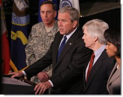 Flanked by Gen. David Petraeus, Commander of the Multi-National Force in Iraq, U.S. Ambassador to Iraq, Ryan Crocker and Secretary of State Dr. Condoleezza Rice, President George W. Bush delivers a statement Saturday, Jan. 12, 2008, during a visit to Camp Arifjan before departing Kuwait. White House photo by Eric Draper