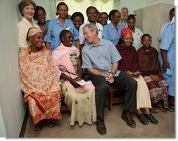 President George W. Bush and Mrs. Laura Bush pose for a photo Monday, Feb. 18, 2008, with patients and staff at the Meru District Hospital outpatient clinic in Arusha, Tanzania. White House photo by Eric Draper