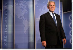 President George W. Bush stands on stage at the Radisson Miami Hotel Friday, Oct. 12, 2007, in Miami, where he delivered remarks on trade policy. Speaking on free trade in the Americas, the President said, "It's in the interests of the United States that prosperity spread through Latin America and South America." White House photo by Eric Draper