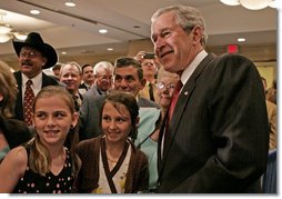 President George W. Bush poses for photos and meets guests following his remarks to the National Cattlemen’s Beef Association Wednesday, March 28, 2007 in Washington, D.C.  White House photo by Joyce Boghosian