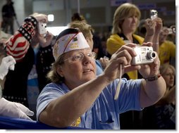 Audience members take photos of President George W. Bush, as he delivers his remarks Wednesday, Aug. 22, 2007, to the Veterans of Foreign Wars National Convention in Kansas City, Mo. White House photo by Chris Greenberg