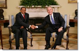 President George W. Bush shakes hands with Tanzania President Jakaya Kikwete in the Oval Office at the White House Friday, Aug. 29, 2008, during their meeting with reporters. White House photo by Chris Greenberg